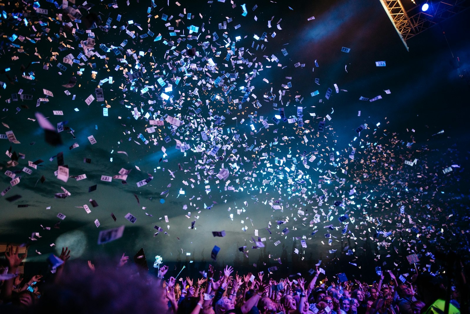 Blue light and confetti — corporate night peak