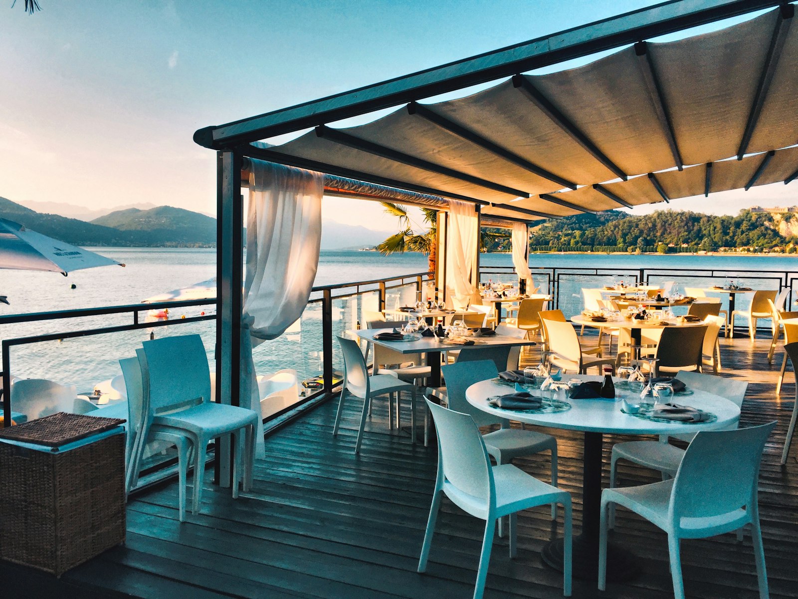 Waterfront dining terrace at golden hour